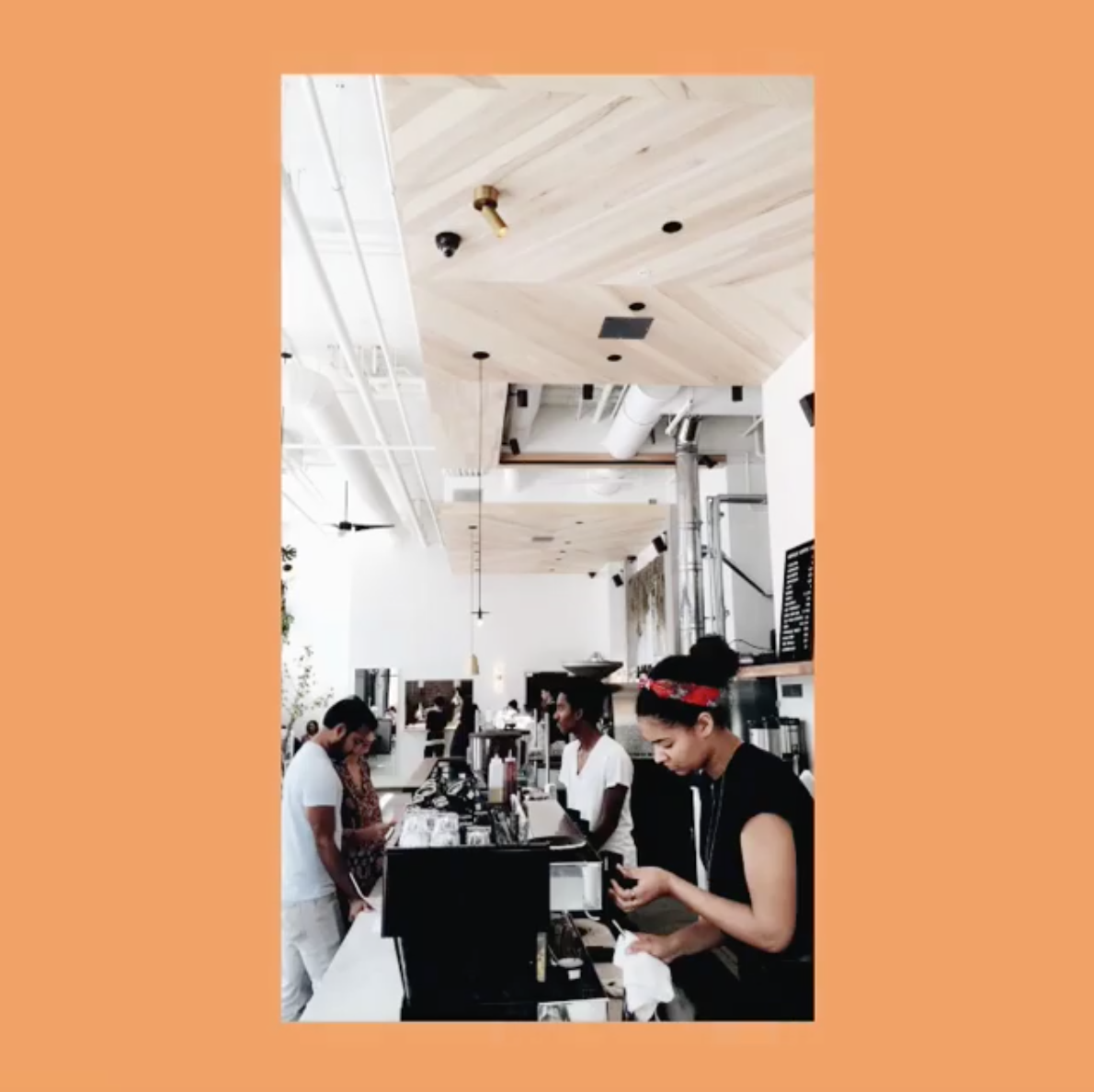 Image of Cafe Reveille in colorblocked orange frame
