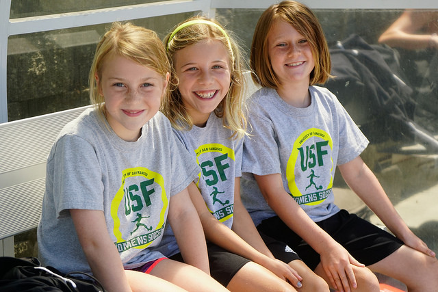 Summer Camp attendees wearing shirts designed by Arriola