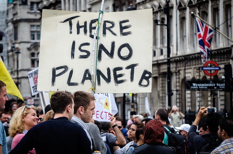 Protester holds a sign that reads "There is No Planet B"