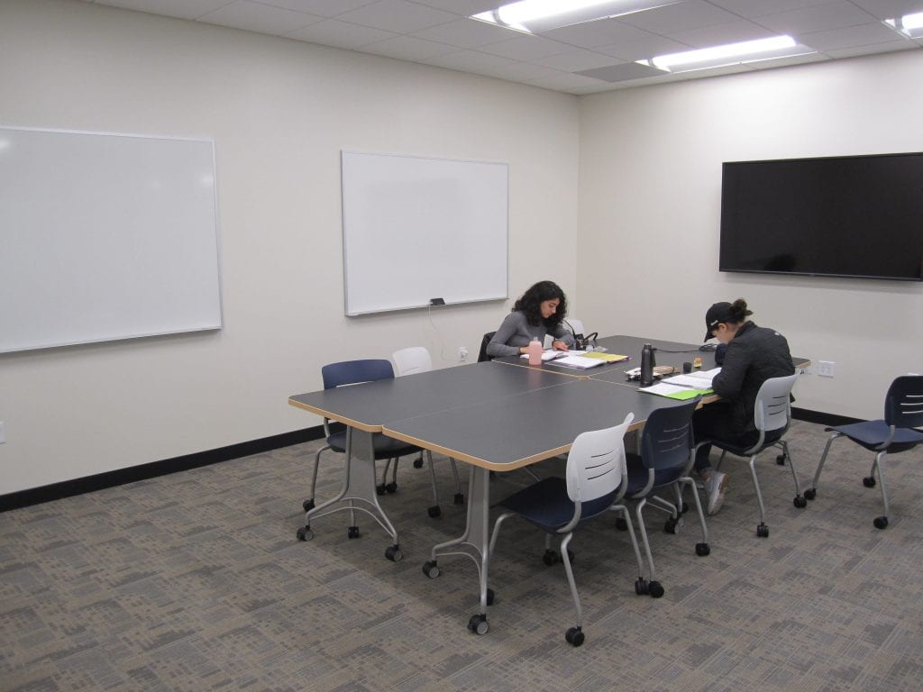 Gleeson 2nd Floor: students using one of the new, bookable study rooms