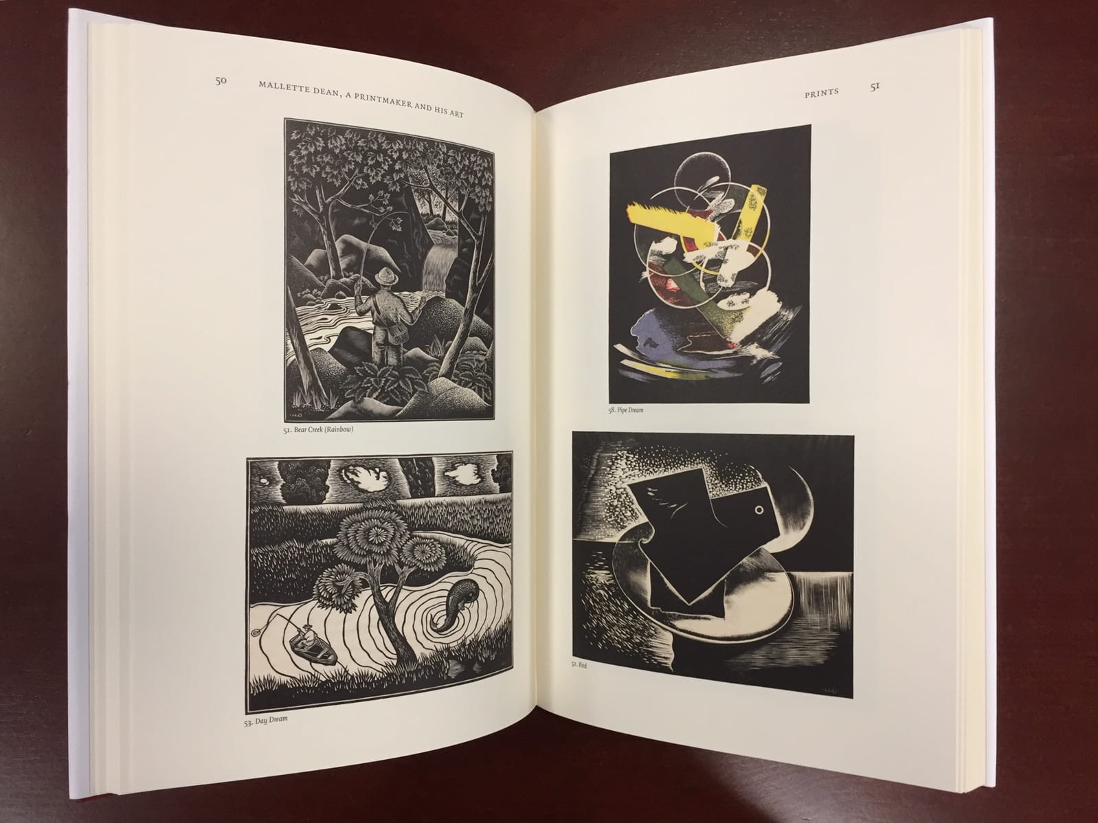 open pages of John Hawk's book featuring surreal prints by Mallette Dean