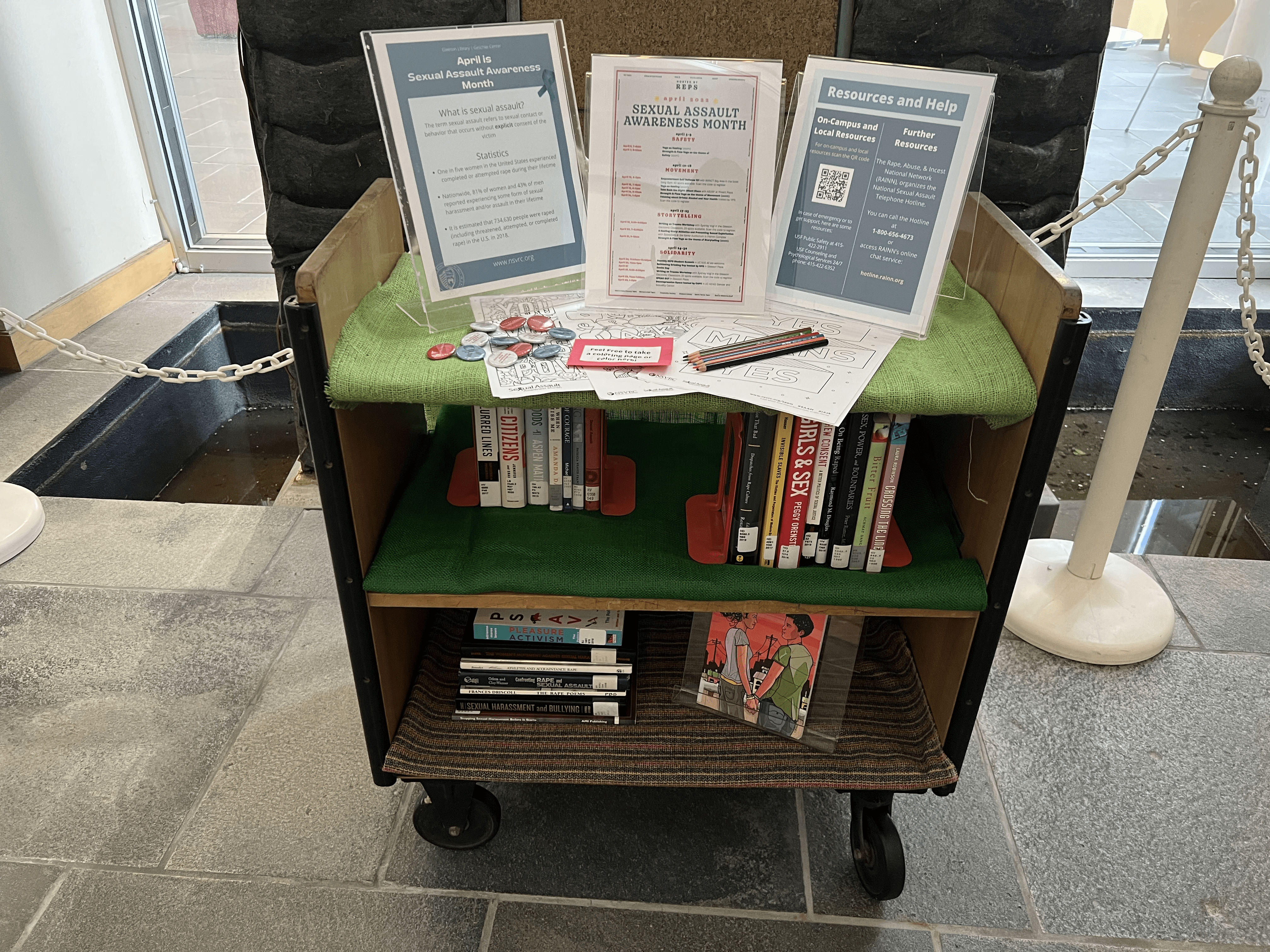 Picture of the library cart display for sexual assault awareness month