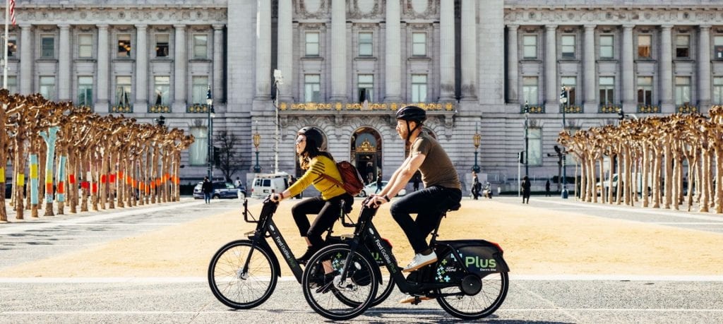 Two people cycling on electric bicycles
