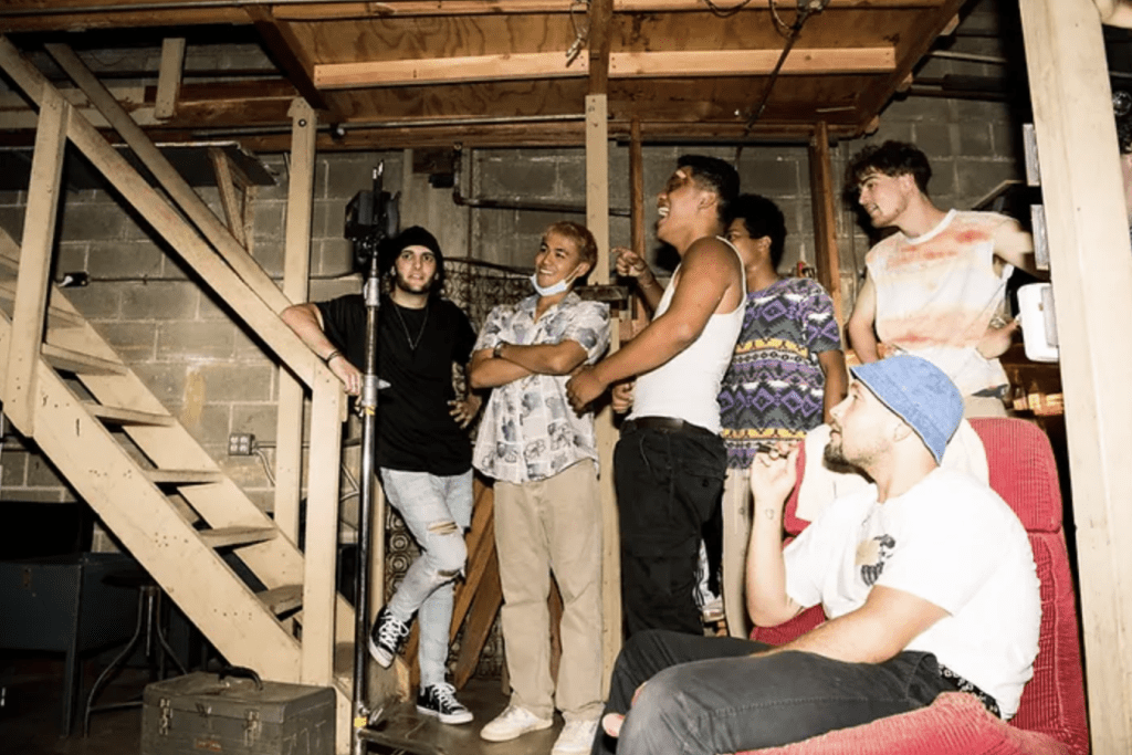 people standing at the bottom of a stairway on the set of fight night