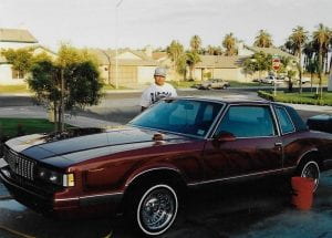 a red lowride car back in the 80s
