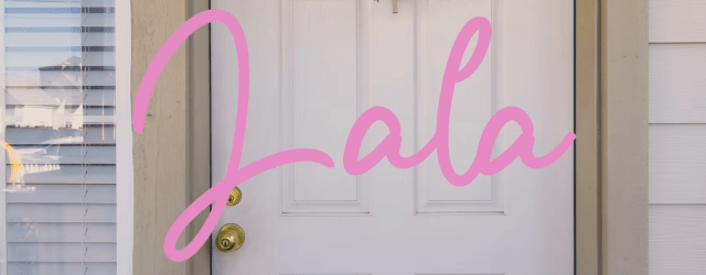 a door with pink letters spelling Lala in front of it.