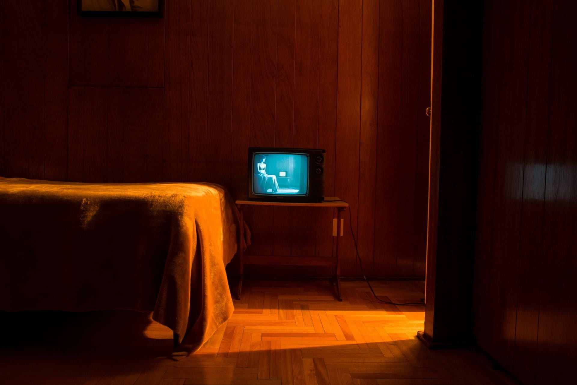 a hotel room with a television set in it
