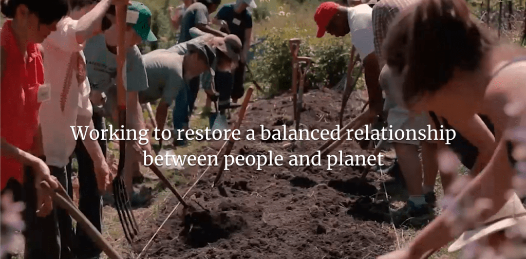 Image of people farming with quote saying "working to restore a balanced relationship between people and planet"