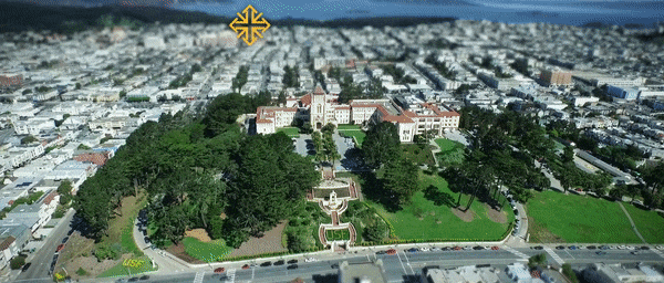 Animated aerial view of USF with the text "University of San Francisco, Green Happens Here".