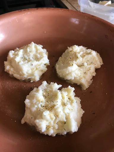 An aerial view of mashed potato dollops.