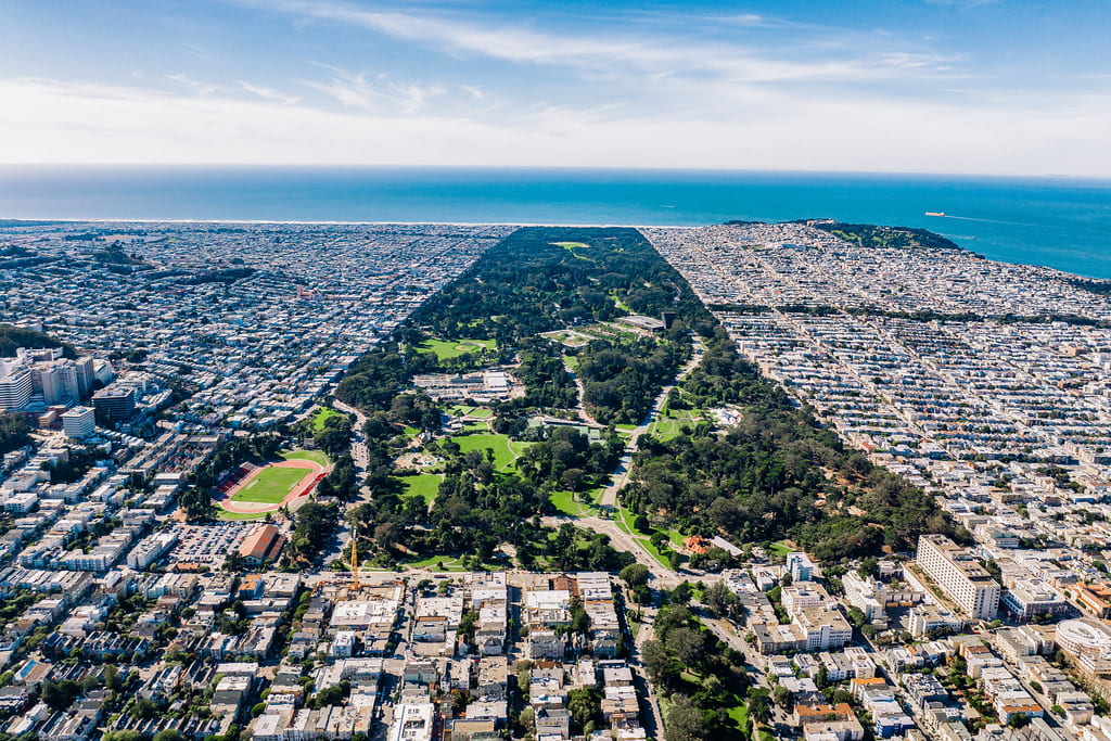 Overhead view of Golden Gate Park with the ocean in the background.