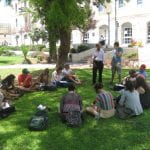 a class learning on a lawn.